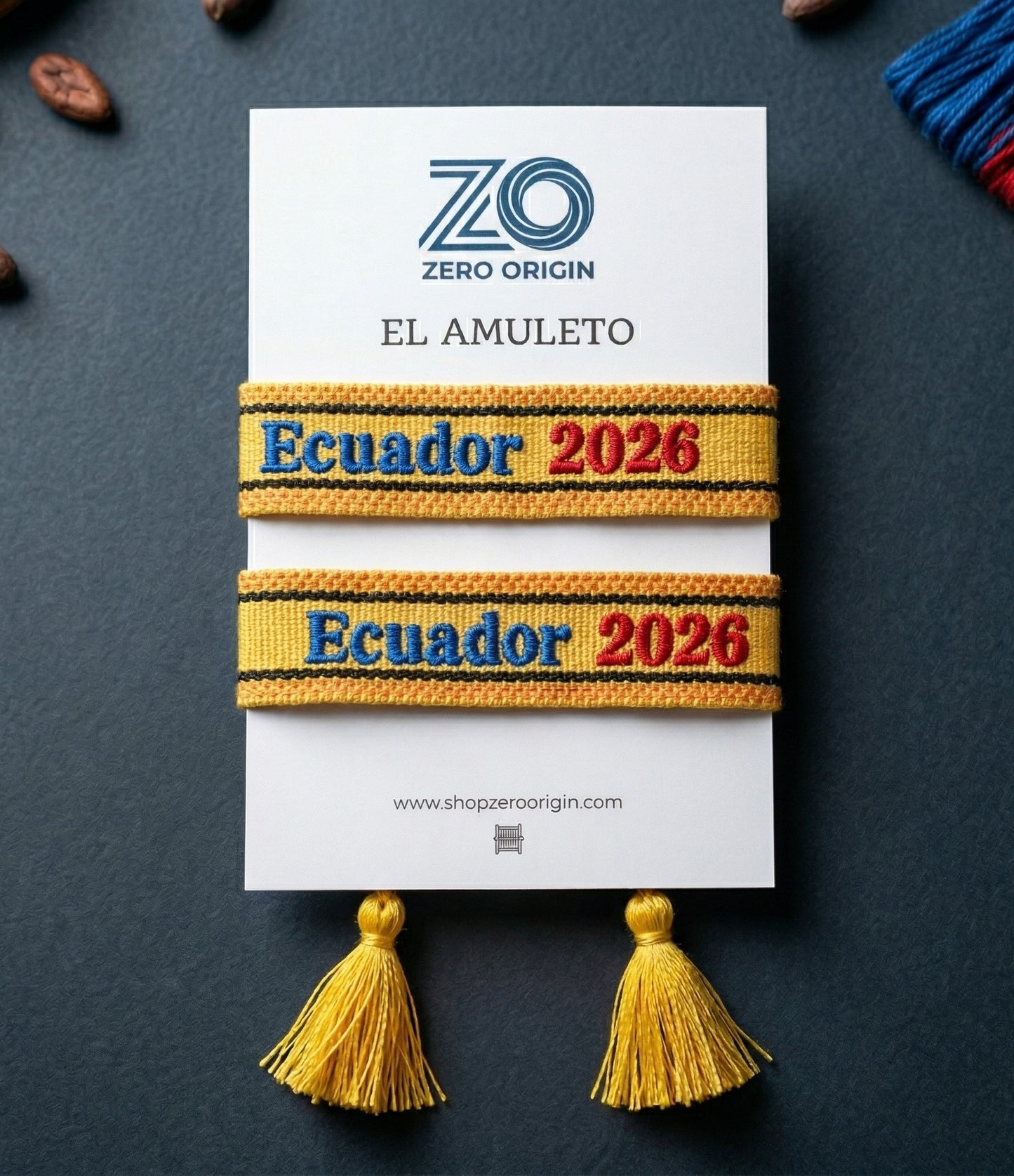 Bracelets with 'Ecuador 2026' text on a Zero Origin card with tassels.