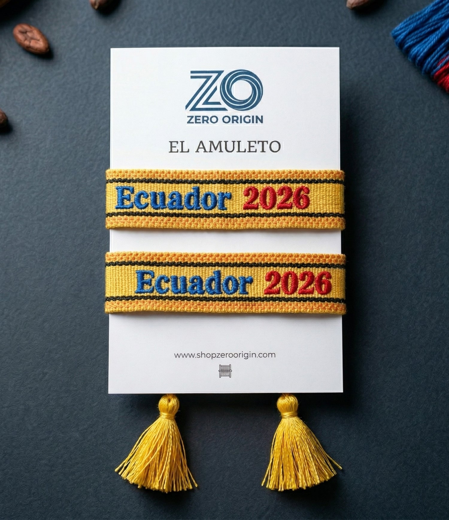 Bracelets with 'Ecuador 2026' text on a Zero Origin card with tassels.